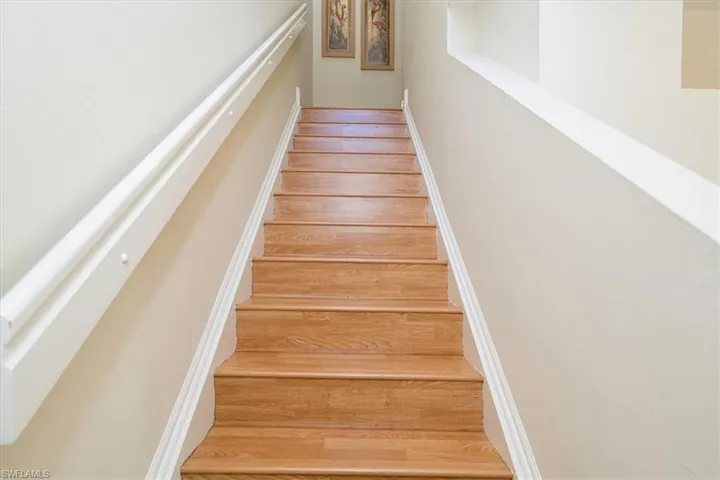 Stairs with Laminate Light Wood Flooring