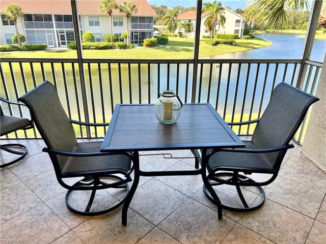 Balcony featuring water view & sunset views
