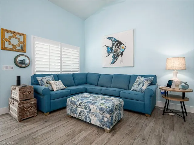LIVING AREA WITH PICTURE WINDOW TO THE STREET AND BAY.
