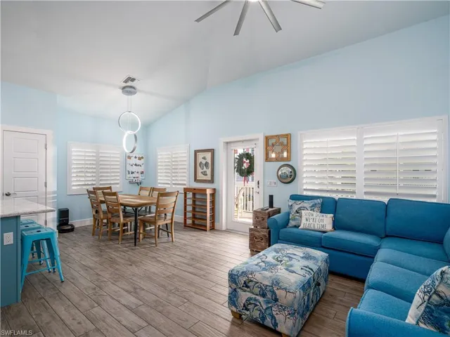 OPPOSITE SIDE VIEW OF LIVING AND DINING AREA.