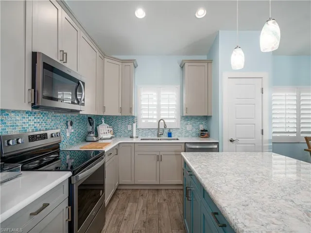 MODERN KITCHEN WITHQUALITY CUSTOM CABINETRY AND QUARTZ COUNTERTOPS.