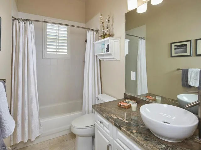 Guest bathroom with tub/shower.