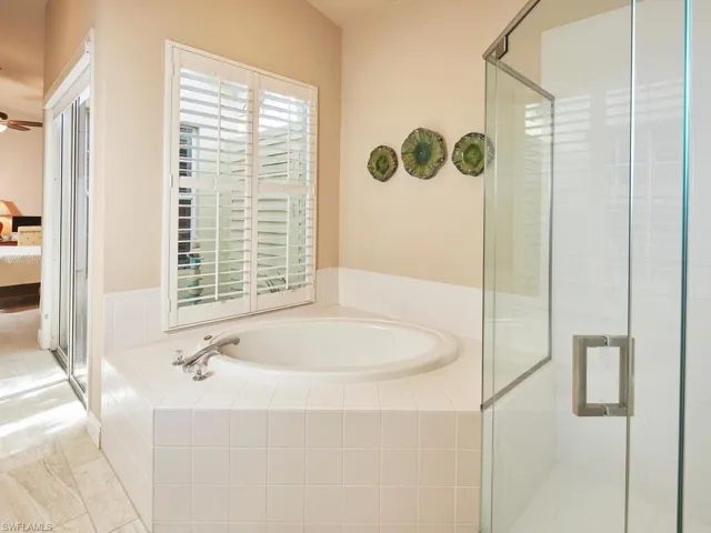 Walk in shower and soaking tub in primary en suite.