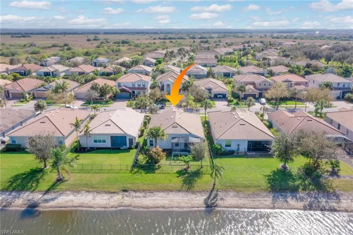 Drone / aerial view featuring a water view and a residential view