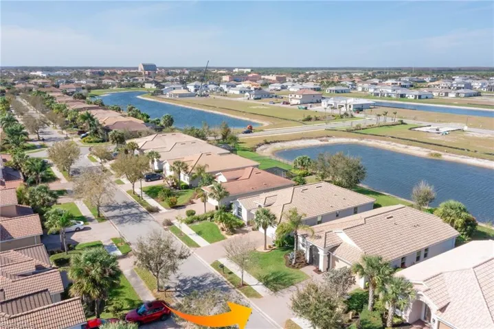 Aerial view featuring a water view and a residential view