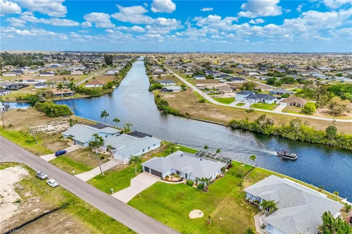 Aerial view of residential area with a large body of water