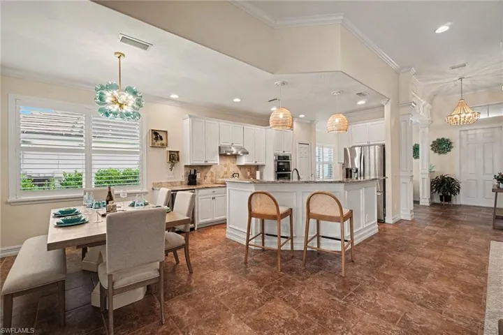 Raised panel molding on island with bar seating