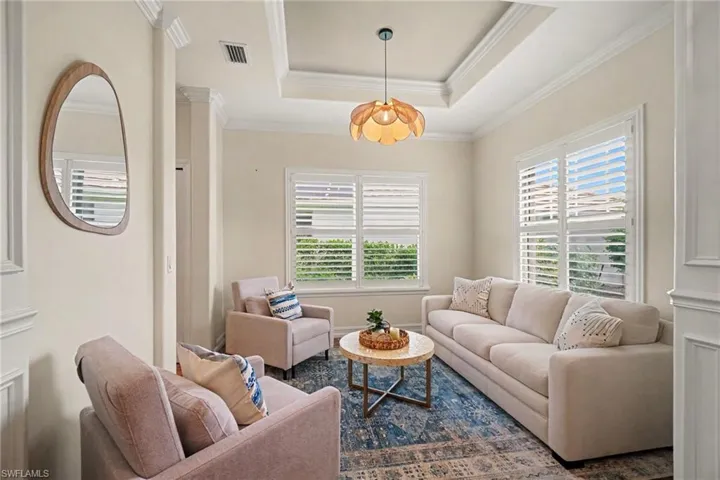 Den #1: tray ceiling with crown molding and raised panel molding on columns