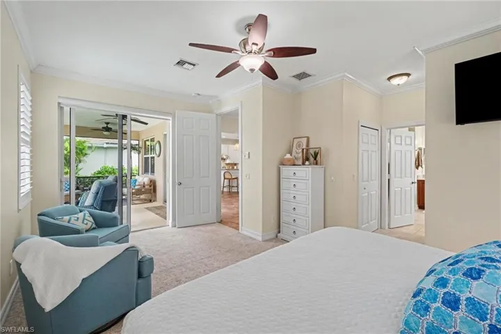 Sliding glass doors leading to lanai from primary bedroom