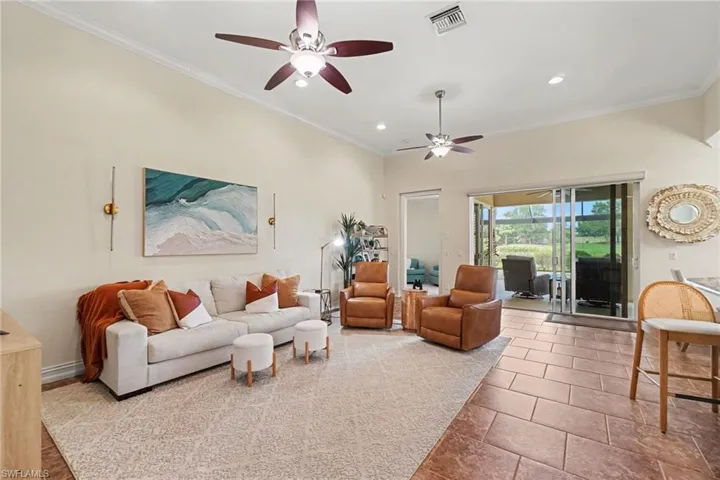 Straight line view of pool, lake and golf course from foyer entry!