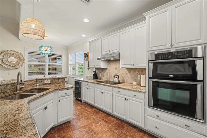 Newly refinished and painted cabinetry with brushed nickel hardware
