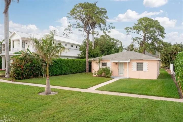 View of front of house with a front lawn