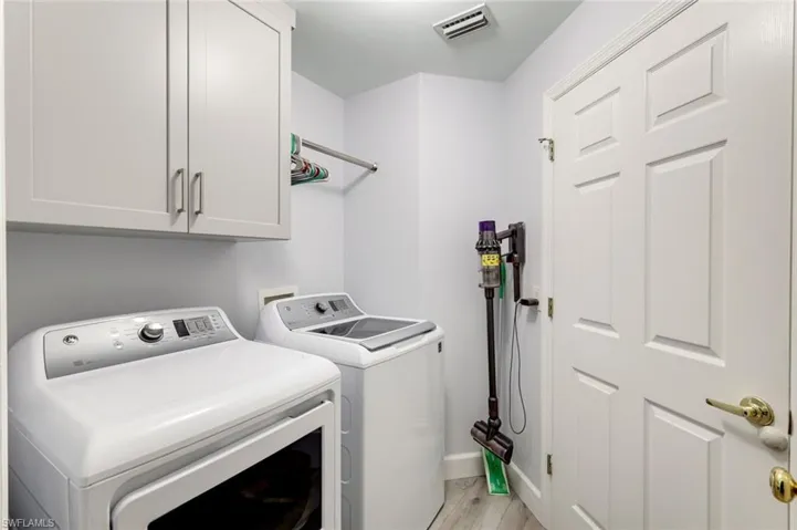 Interior Utility Room with Hanging Rack and upper cabinetry!