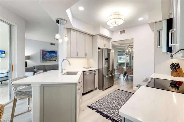 Stunning renovated kitchen with single level quartz countertops, stainless steel appliances, with updated modern pulls.