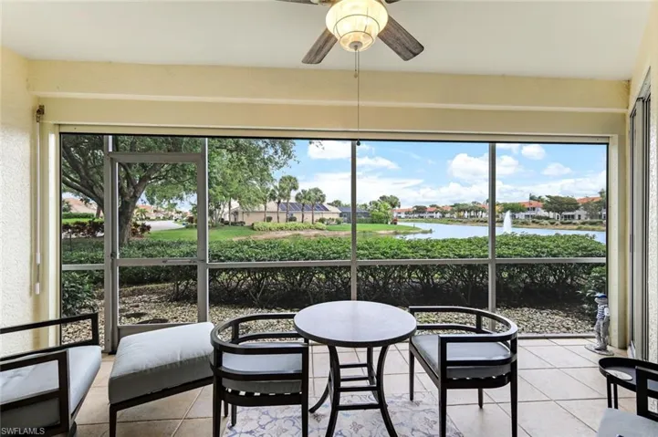 Your lovely lanai water and fountain view with ELECTRIC HURRICANE SHUTTER and ceiling fan / light!