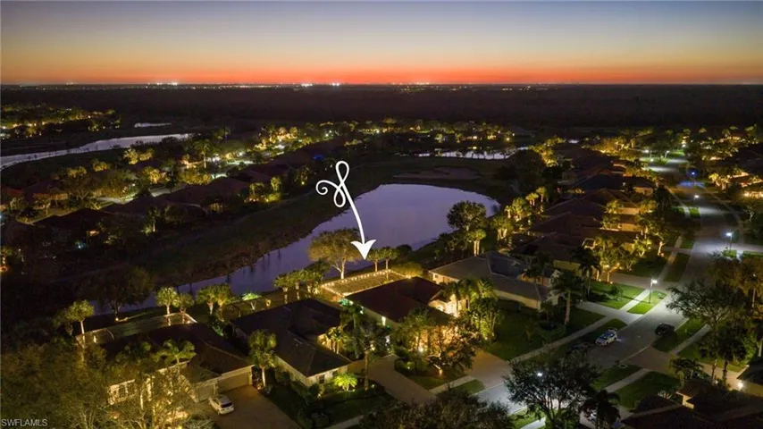 Night shot of property aerial view