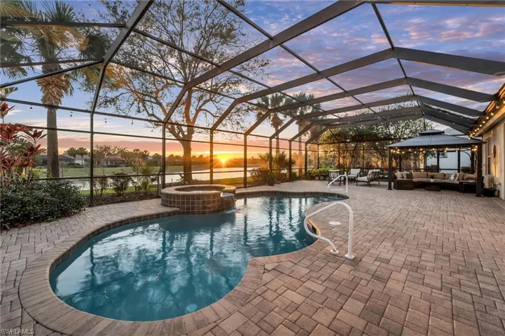 Outdoor pool area with sunset views