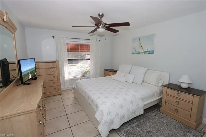 Bedroom featuring ceiling fan and light tile patterned floors