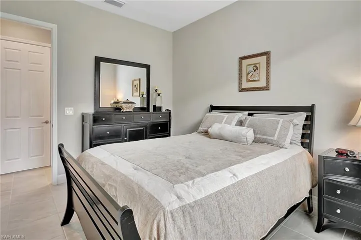 Bedroom with light tile patterned floors