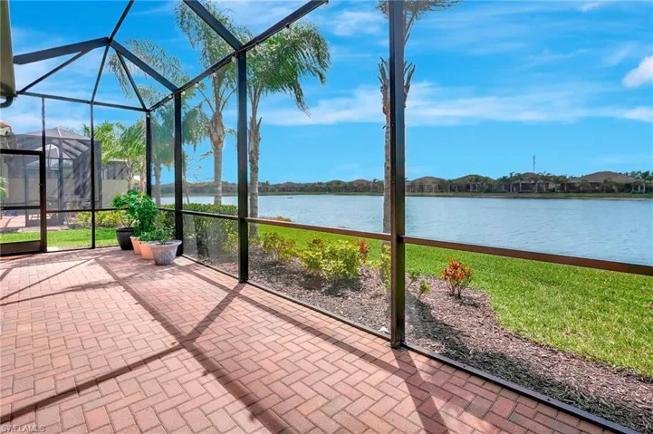 Unfurnished sunroom featuring a water view