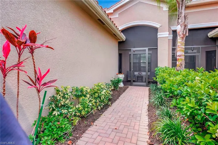 View of exterior entry featuring stucco siding