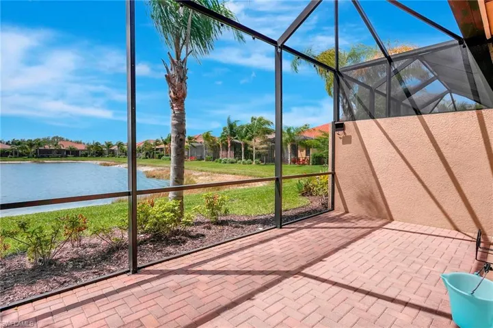 Unfurnished sunroom featuring a water view