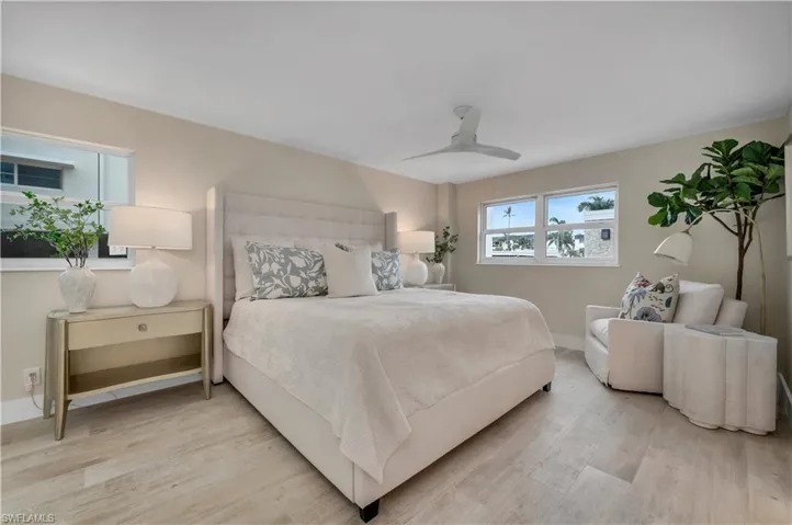 Bedroom featuring light wood-type flooring and ceiling fan