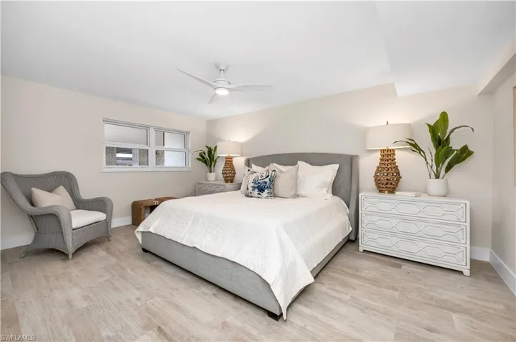 Bedroom with wood-type flooring and ceiling fan