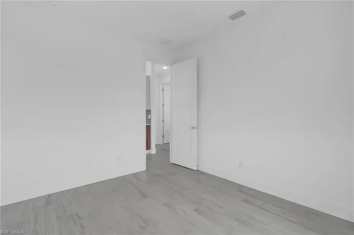 Spare room with light wood finished floors and baseboards