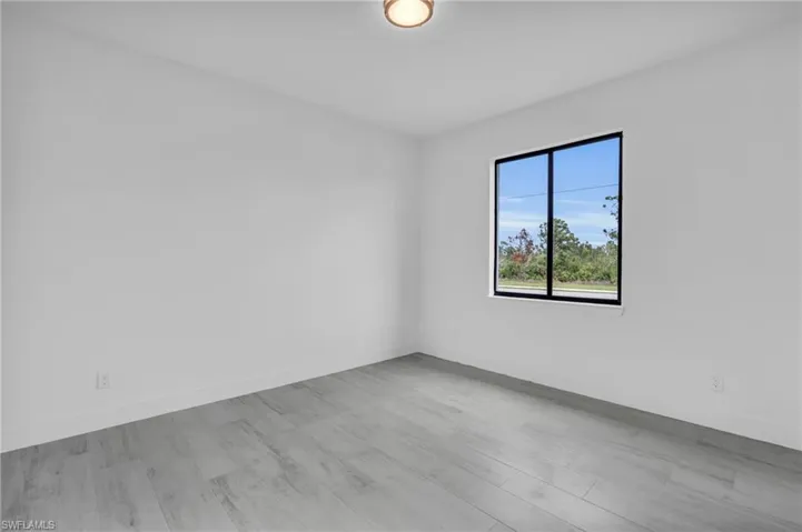 Empty room featuring wood finished floors