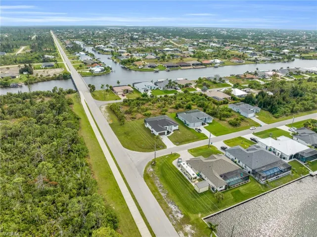 Aerial view of residential area with a nearby body of water