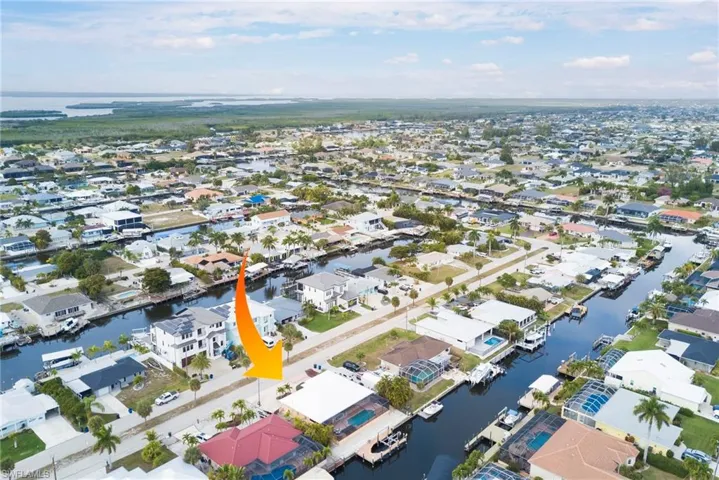 Aerial view of residential area with a nearby body of water