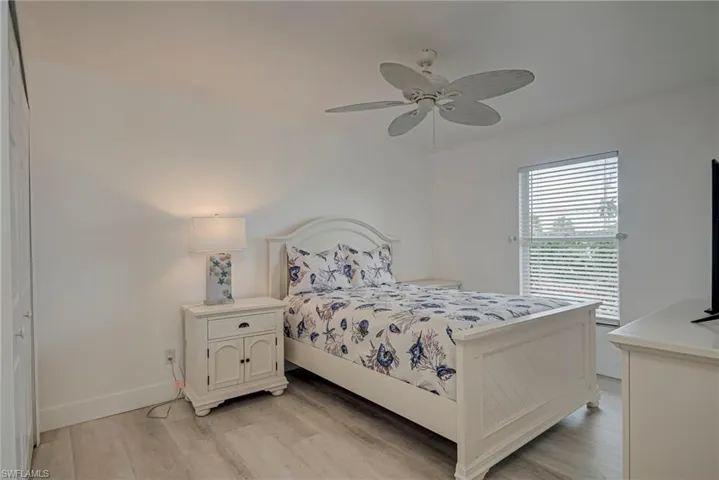 Bedroom featuring light wood finished floors and ceiling fan