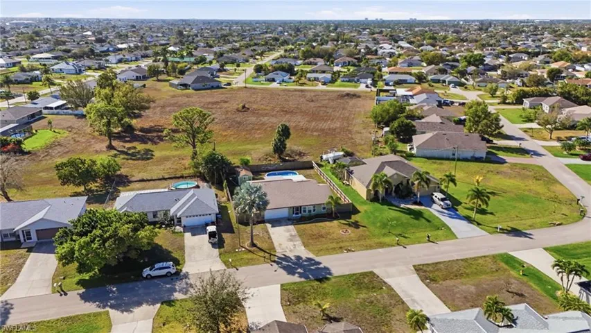 Aerial overview of property's location featuring nearby suburban area