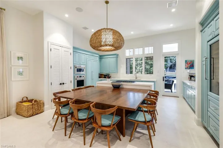 Dining space with baseboards and recessed lighting