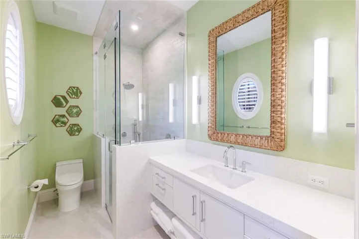 Bathroom with vanity and a shower stall