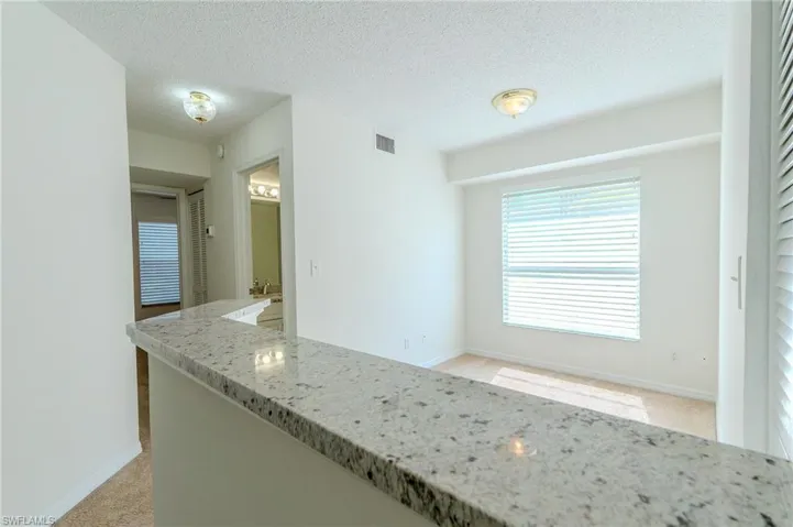 View of den and hallway to second bedroom