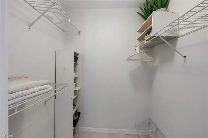 Walk in closet featuring light tile patterned floors