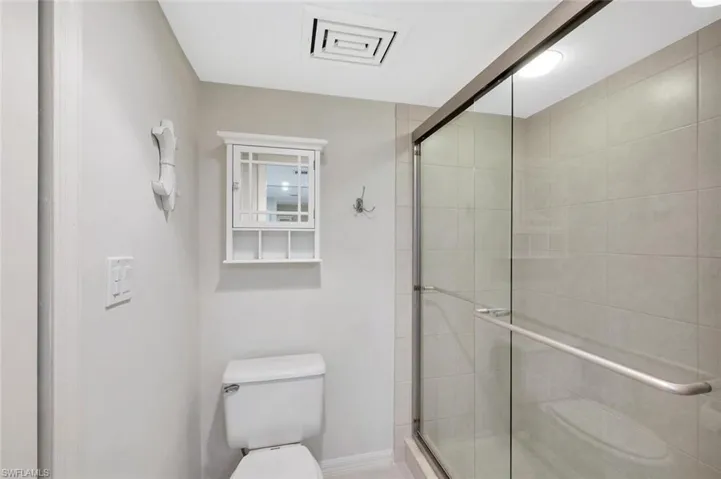 Full bathroom with a stall shower
