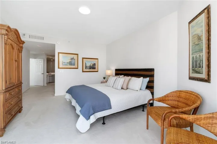 Bedroom with light colored carpet