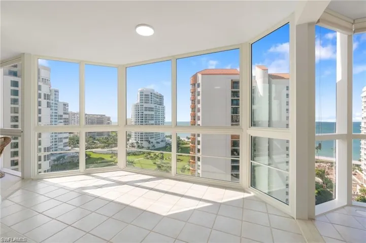 Unfurnished sunroom featuring a water view and a healthy amount of sunlight