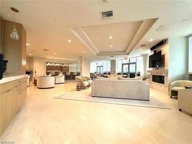 Living room featuring a raised ceiling