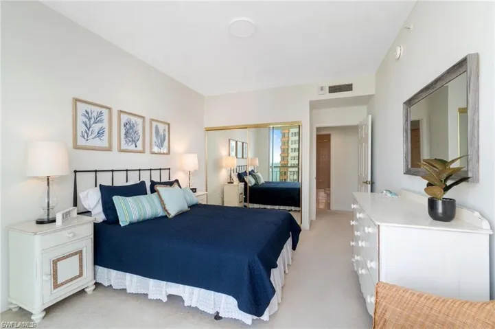 Carpeted bedroom featuring a closet