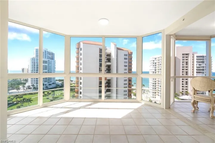 Unfurnished sunroom with a water view and plenty of natural light