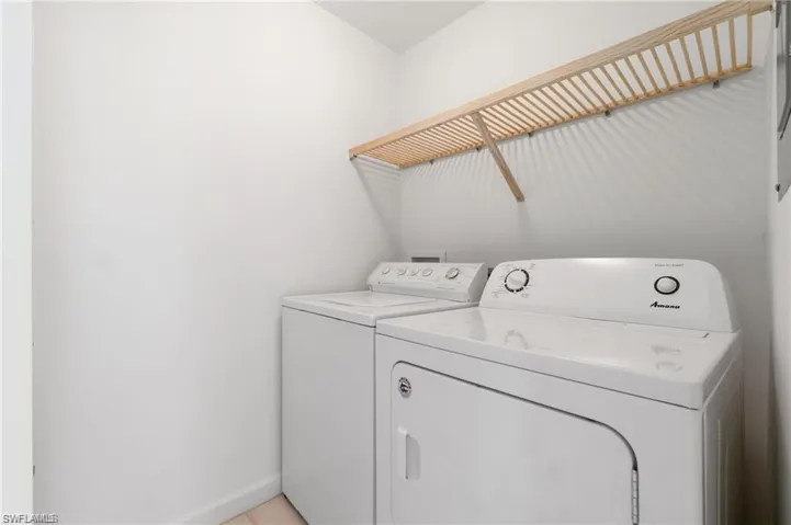 Washroom featuring independent washer and dryer