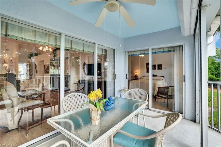 Sunroom / solarium featuring ceiling fan and a healthy amount of sunlight