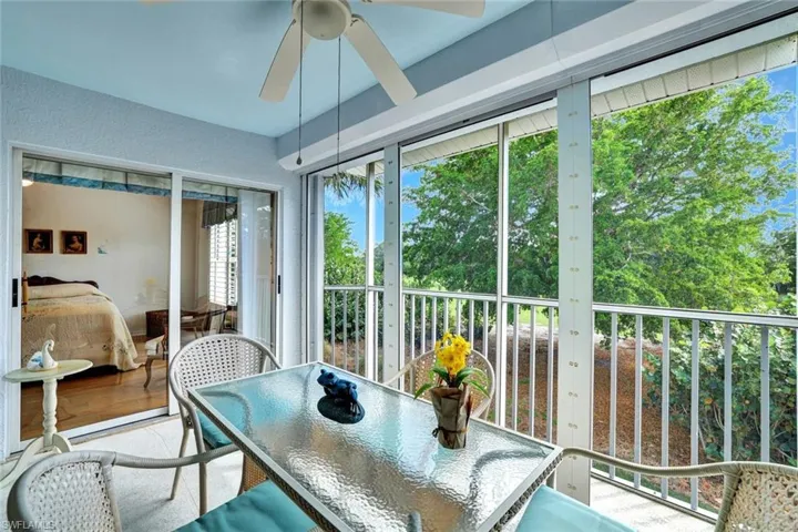 Sunroom / solarium featuring ceiling fan