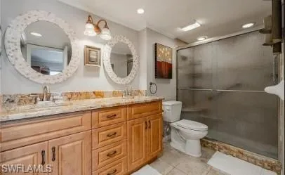 Full bath with double vanity, a stall shower, recessed lighting, light tile patterned floors, and crown molding