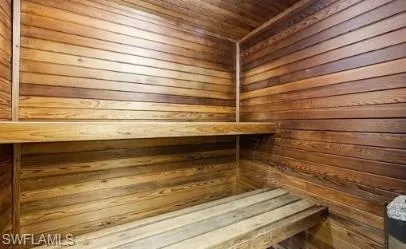 Sauna with wood walls and wooden ceiling