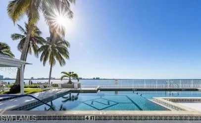 Outdoor pool featuring a water view